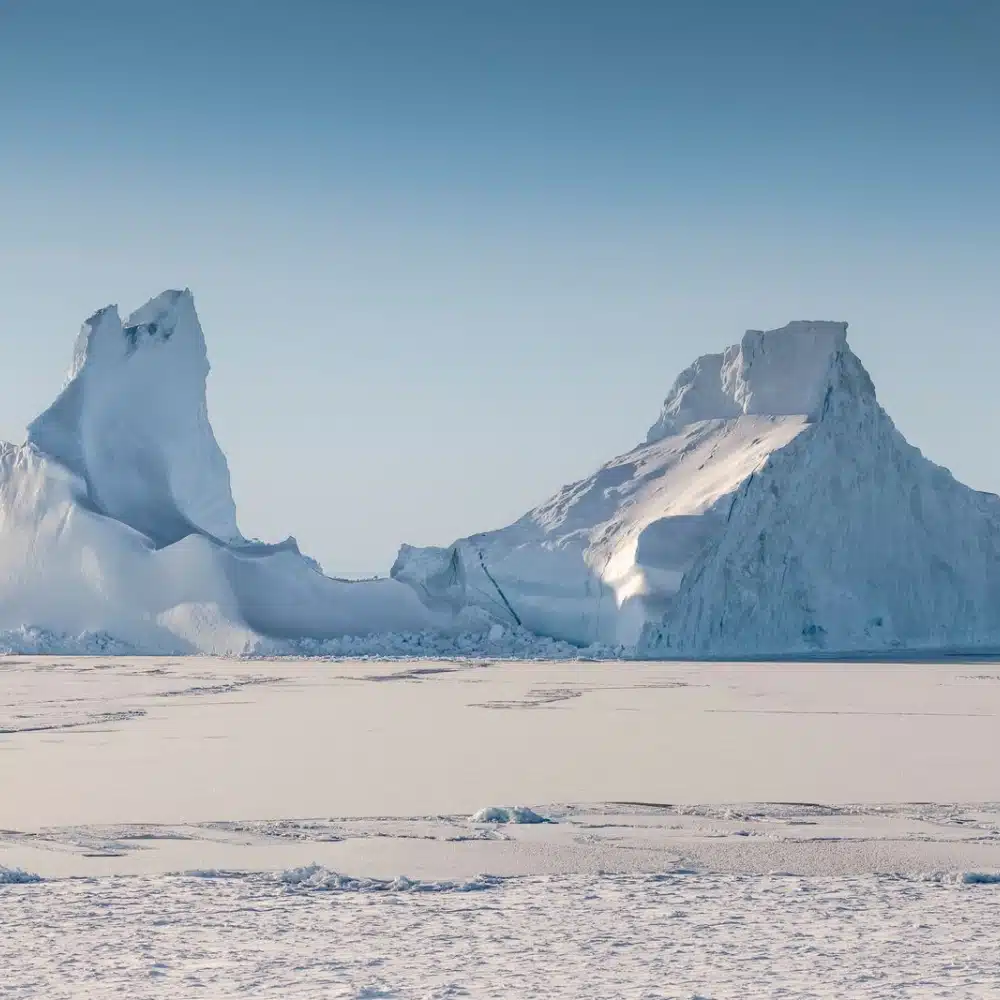 travelling-arctic An iceberg on the pack ice in Greenland